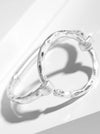 Hammered Metal Circle Accent Spring Hook Closure Bangle Bracelet: Worn silver